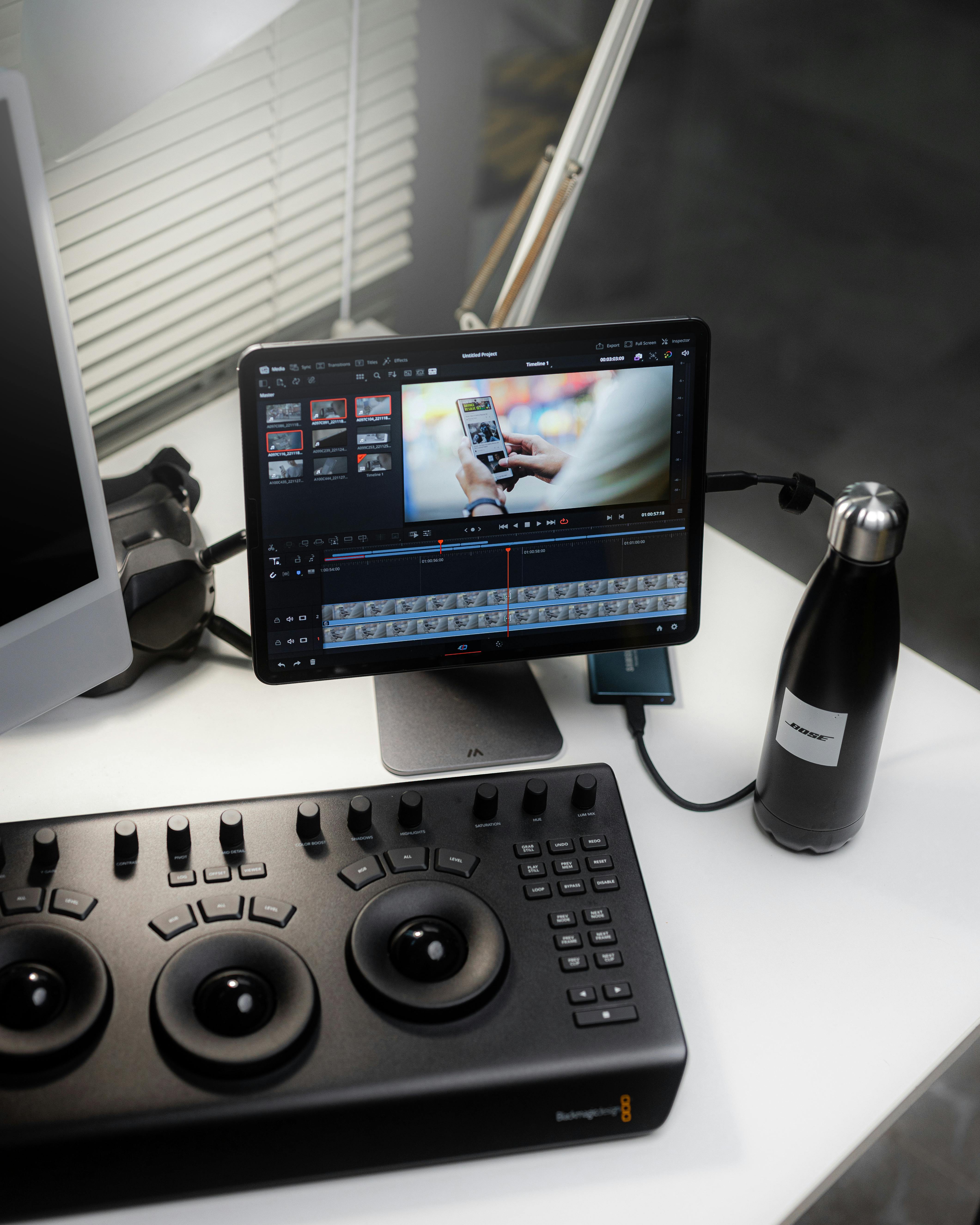 Professional video editing setup with tablet and Blackmagic control surface