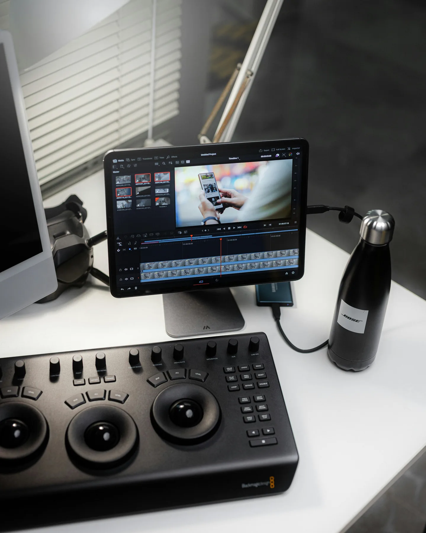 Professional video editing setup with tablet and Blackmagic control surface